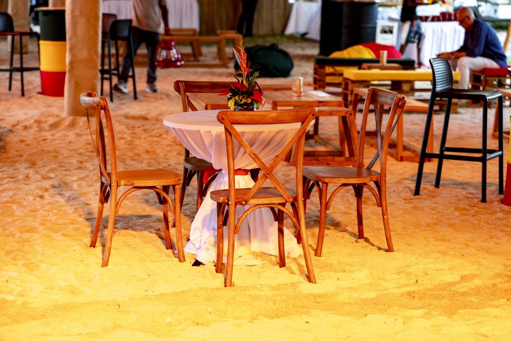 Reggae Night Mauritius beach event with colourful décor, drum cocktail tables, pallet photo booth and immersive event styling by Impact Production Group