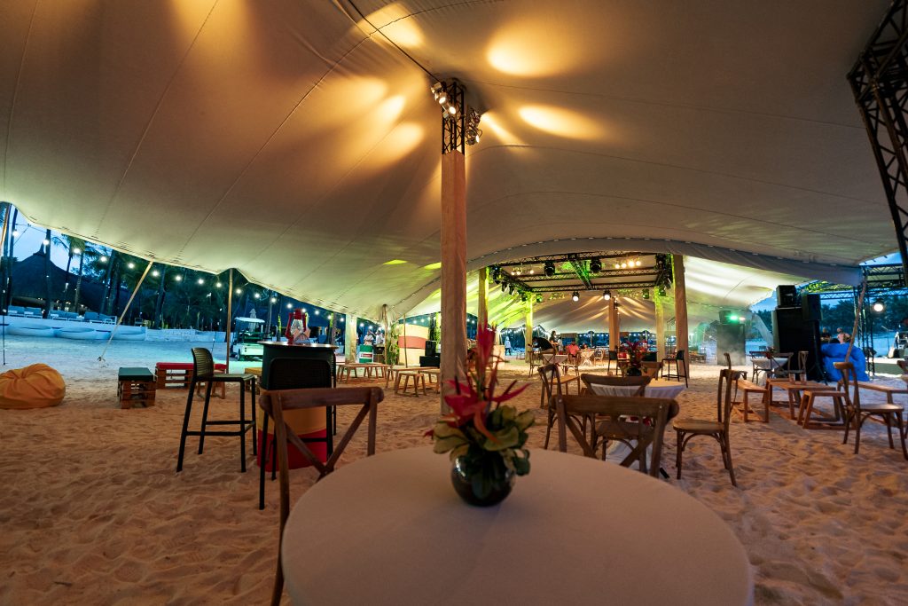 Reggae Night Mauritius beach event with colourful décor, drum cocktail tables, pallet photo booth and immersive event styling by Impact Production Group