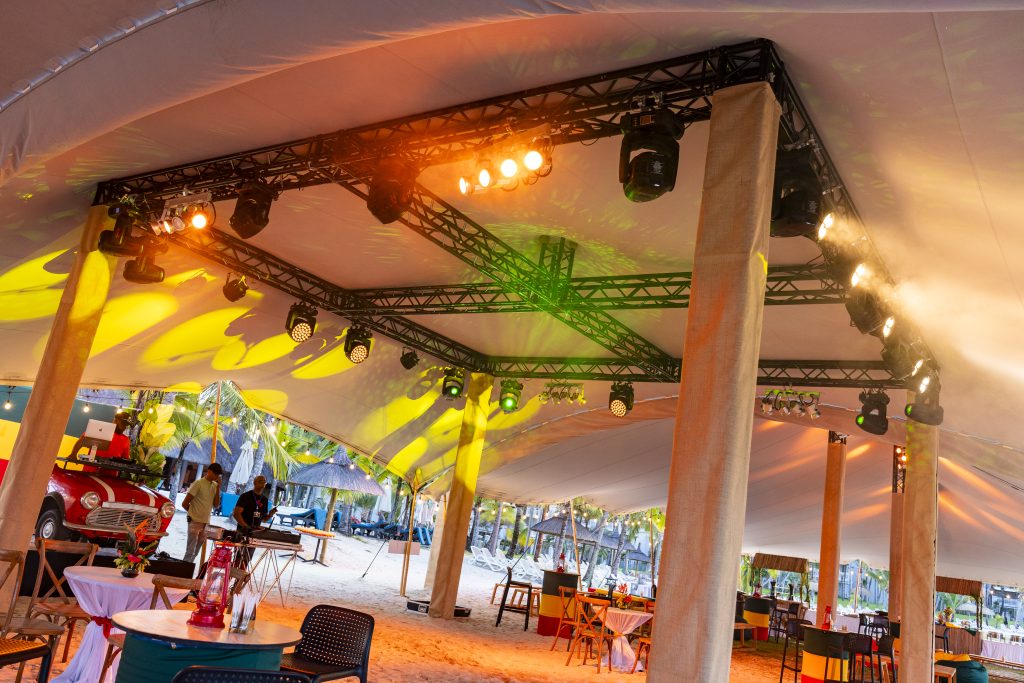 Reggae Night Mauritius beach event with colourful décor, drum cocktail tables, pallet photo booth and immersive event styling by Impact Production Group