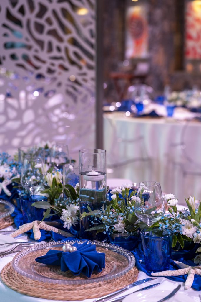 Sea-themed welcome dinner Mauritius with elegant coastal décor and serpentine tables

Sea-themed welcome dinner Mauritius designed by Impact Production Group at Shandrani Beachcomber

Luxury sea-themed welcome dinner Mauritius featuring blue lighting and marine-inspired tablescape