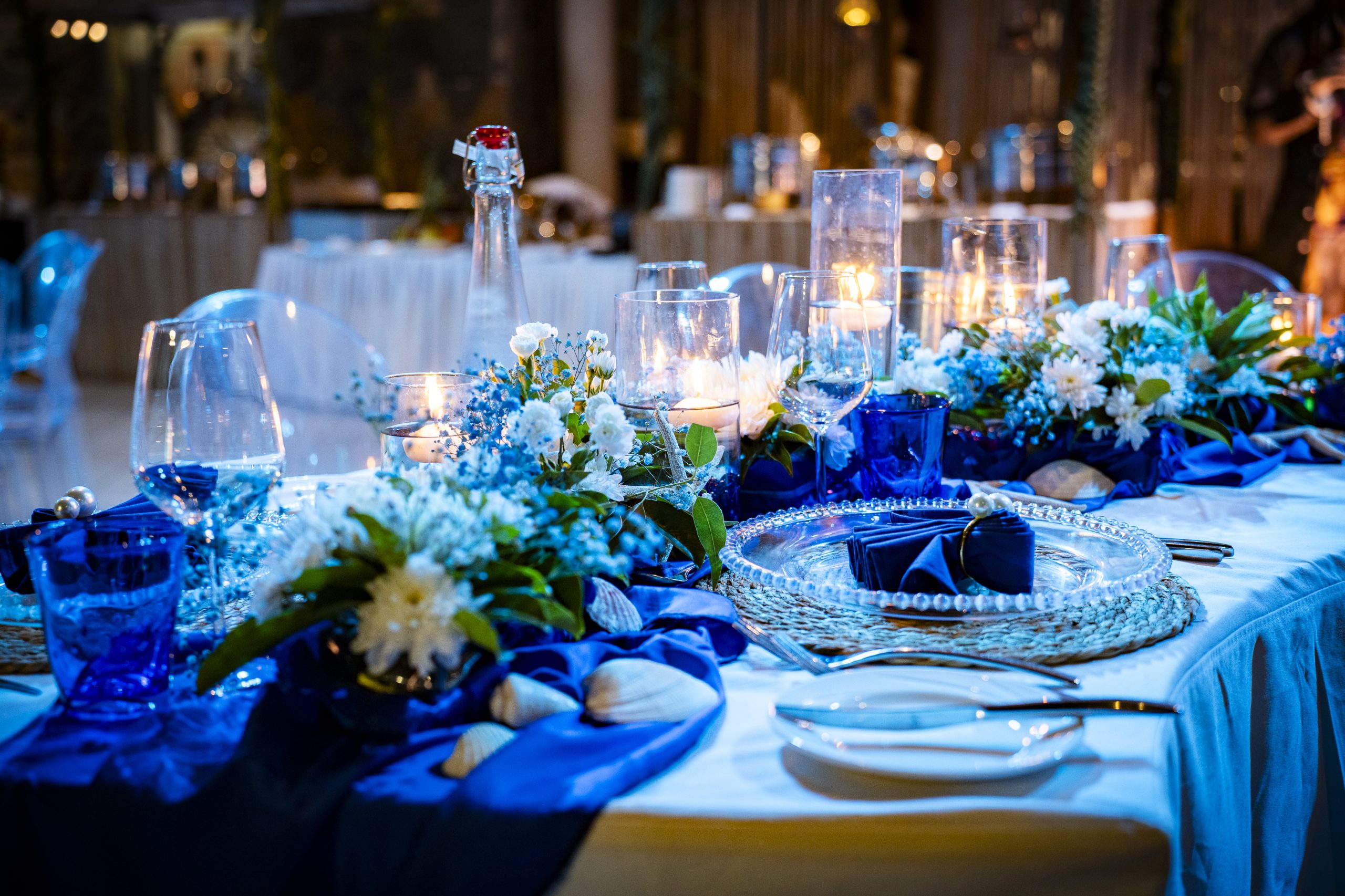 "Elegant sea-themed welcome dinner at Shandrani Beachcomber Mauritius designed by Impact Production Group with coastal tablescape and blue décor.