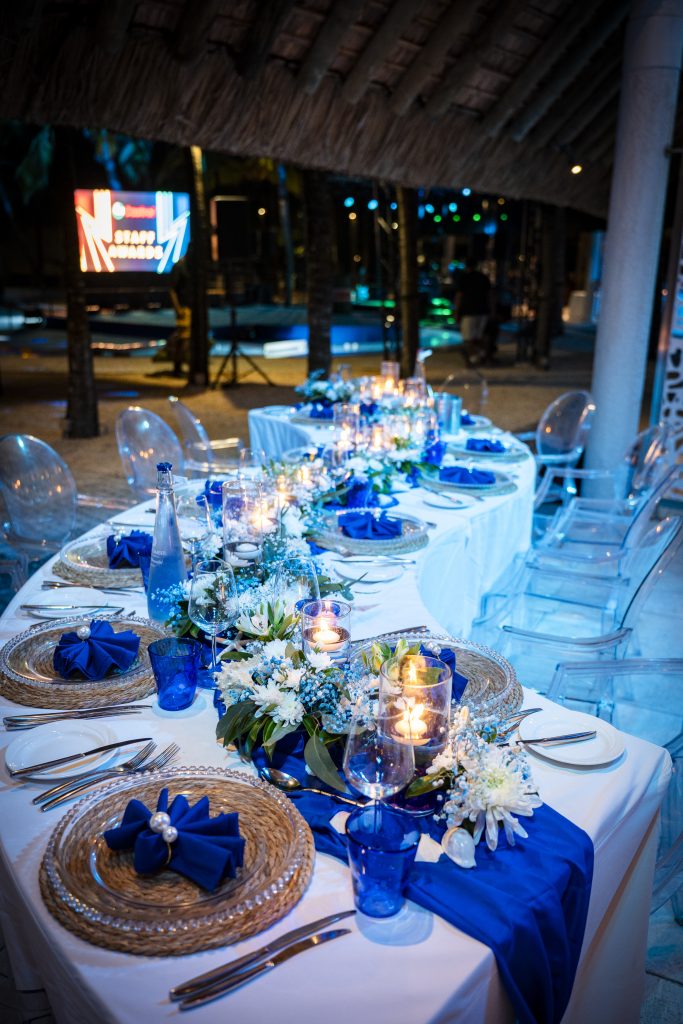 Sea-themed welcome dinner Mauritius with elegant coastal décor and serpentine tables

Sea-themed welcome dinner Mauritius designed by Impact Production Group at Shandrani Beachcomber

Luxury sea-themed welcome dinner Mauritius featuring blue lighting and marine-inspired tablescape