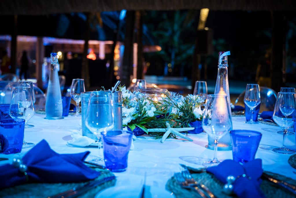 Sea-themed welcome dinner Mauritius with elegant coastal décor and serpentine tables

Sea-themed welcome dinner Mauritius designed by Impact Production Group at Shandrani Beachcomber

Luxury sea-themed welcome dinner Mauritius featuring blue lighting and marine-inspired tablescape